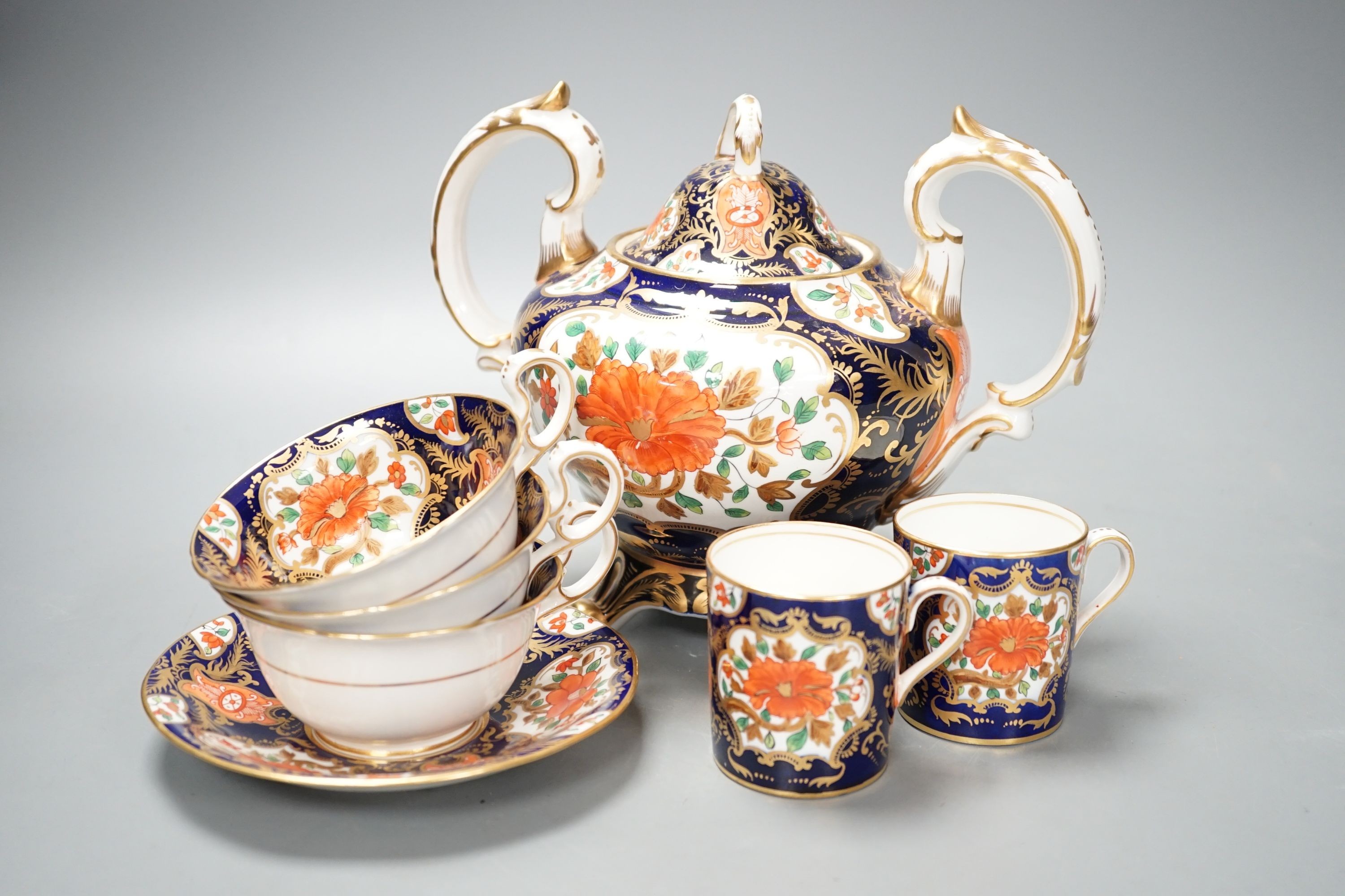 A mid 19th century English bone china fifty-two piece part tea and coffee service, decorated in an Imari pattern
